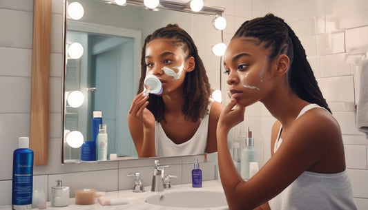 teenager applying skincare in bathroom mirror